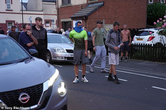 HARTLEPOOL: Masked thugs stare down riot police as violence engulfed the town