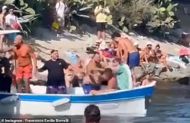 Dozens of men could be seen throwing punches at each other as they argued over who would take the next ferry home, according to witnesses