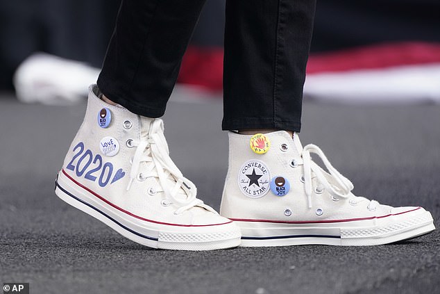 Converse high-top sneakers of Democratic vice presidential candidate Sen. Kamala Harris, D-Calif., are shown as she speaks at a drive-in early voting event,