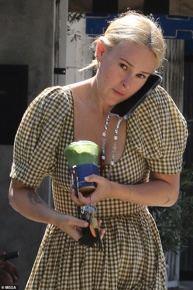 The 35-year-old daughter of Demi Moore , 61, and Bruce Willis , exuded style in a green and white gingham dress featuring a long skirt, short puffy sleeves and a scoop neckline