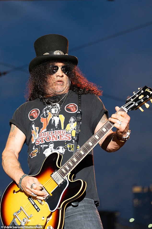 The November Rain performer was clad in a black Rolling Stones T-shirt with dark gray jeans and his signature top hat at the show in the Big Apple