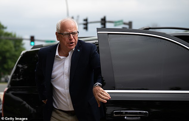 Minnesota Governor Tim Walz arrives to speak at a press conference