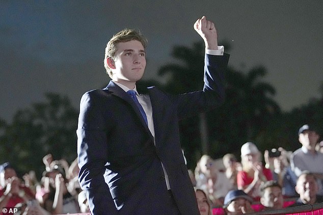 Barron Trump gestures as his father, Republican presidential candidate former President Donald Trump, speaks at a campaign rally at Trump National Doral Miami, Tuesday, July 9, 2024, in Doral, Fla