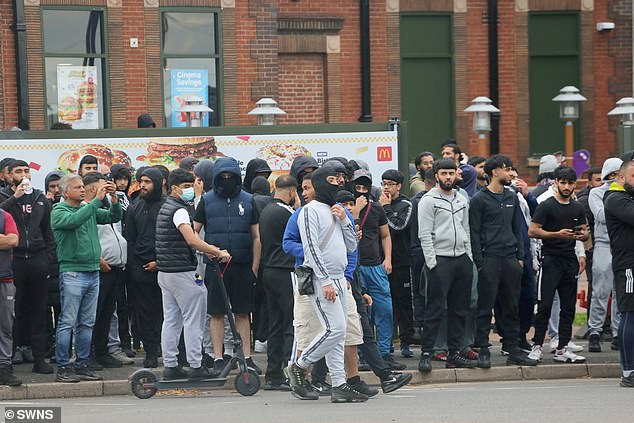 Young men, some in masks, gathered outside a Mcdonalds in Bordesley Green amid rumours of a far-right gathering