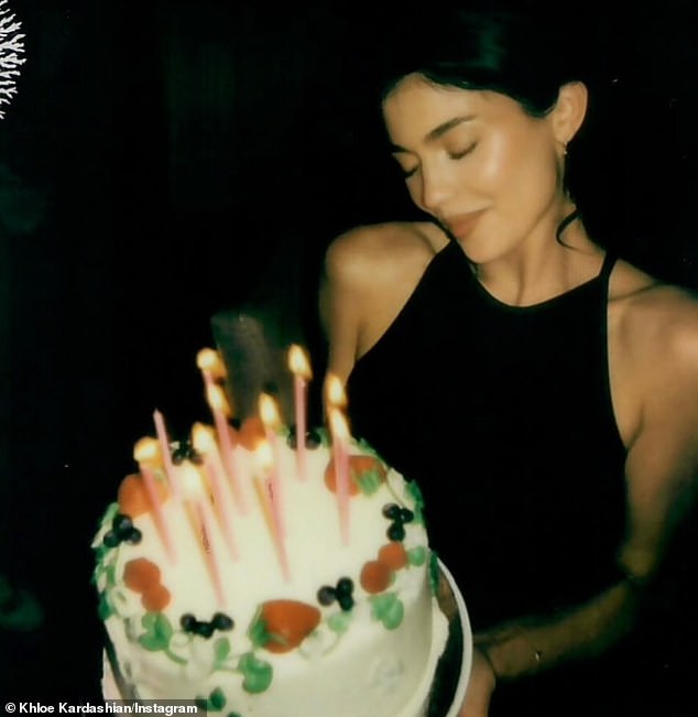 Kylie's older sister Khloe Kardashian shared a photo of Kylie with her birthday cake on Saturday