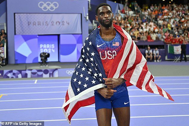 Silver medallist US' Shelby McEwen celebrates competing in the men's high jump final