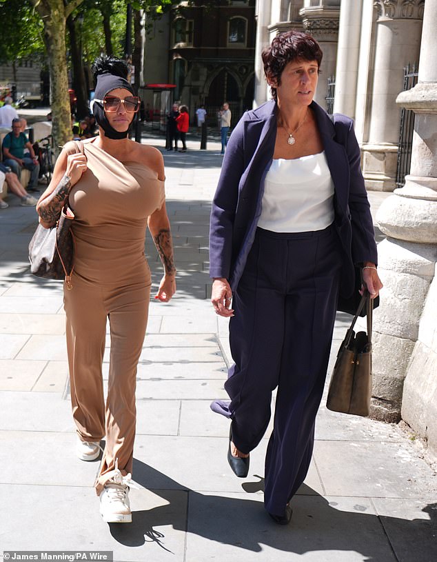 Katie Price is seen arriving at the Royal Courts of Justice on Friday for her latest bankruptcy hearing with her former social worker Lynne Rickwood (right)