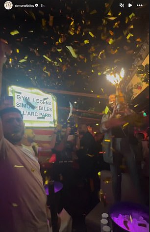 Biles' table at the night club was full of champagne