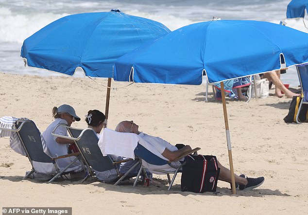 Biden inclined far back in his chair Saturday as he sat with wife Jill Biden and grandaughter Naomi