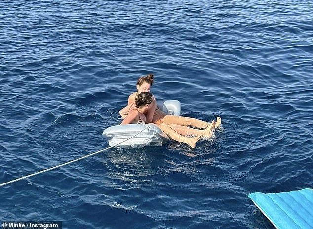 The model-turned-actress, 32, looked in high spirits as she and the musician, also 32, larked about in the sea during their romantic getaway