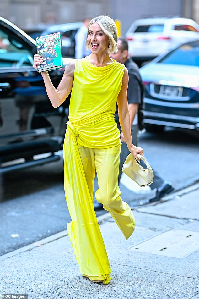 The dancer was also seen in neon lime outside GMA as she held up her book