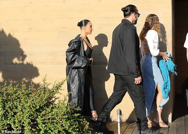 She entered the restaurant with her entourage