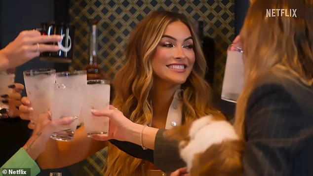 The tense preview begins with fan favorite, Chrishell Stause, making a toast with her costars to 'moving forward, good mojo and new beginnings'