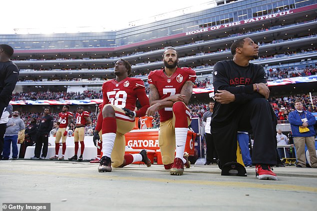 Teammates (from left) Eli Harold, Colin Kaepernick, and Eric Reid kneel in January of 2016