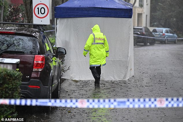 Police are seen at the scene of the young girl's death in Carrara on the Gold Coast on Wednesday