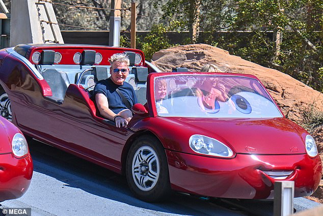 Both father and son flashed beaming smiles as they made their way around the ride, looking like they were having the time of their lives