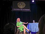 Irritated Liz Truss storms off stage as 'I crashed the economy' banner featuring a lettuce was unfurled behind her as she promoted her book