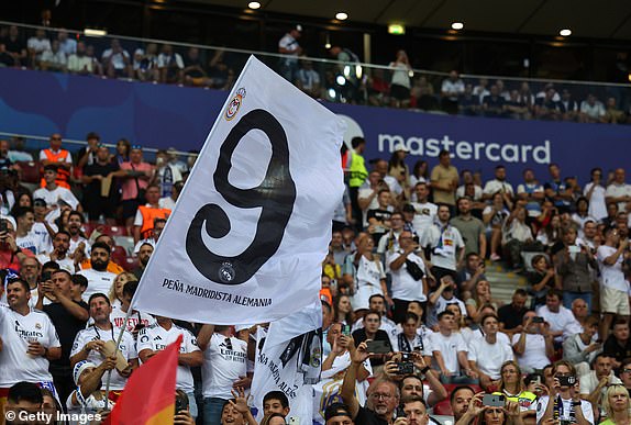 WARSAW, POLAND - AUGUST 14: Real Madrid fans hold up flags and banners for Kylian Mbappe of Real Madrid  during the UEFA Super Cup 2024 match between Real Madrid and Atalanta BC at National Stadium on August 14, 2024 in Warsaw, Poland. (Photo by Robbie Jay Barratt - AMA/Getty Images)