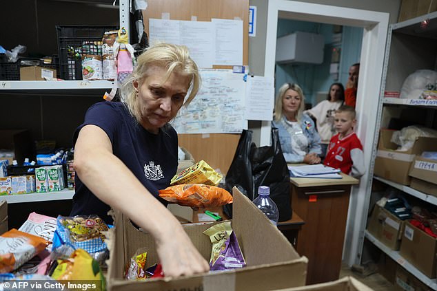 Refugees displaced by the Kursk attack receive humanitarian aid at a collection station in Moscow on August 13