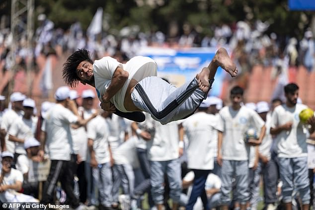 Helicopters also jetted over the Ghazi stadium in Kabul, where hundreds of men gathered to hear speeches, Taliban anthems and see athletic performances