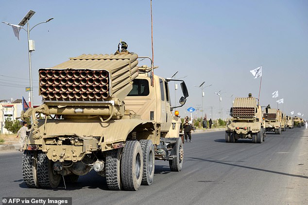 205 Al-Badr Corps carrying the black-and-white flag of the Islamic Emirate of Afghanistan