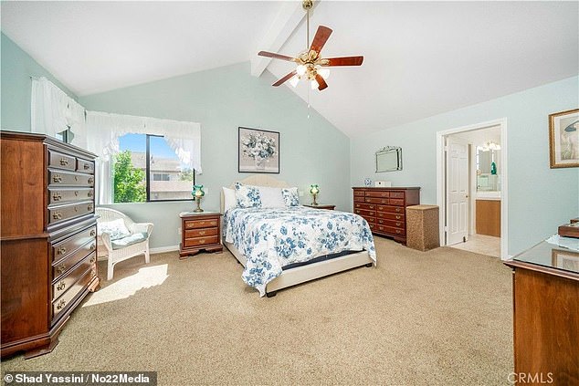 The home's four bedrooms are situated in the upper level of the home, as the home's master bedroom has vaulted ceilings