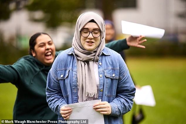 Pupils receive their results today at Parrs Wood High School in Didsbury, south Manchester