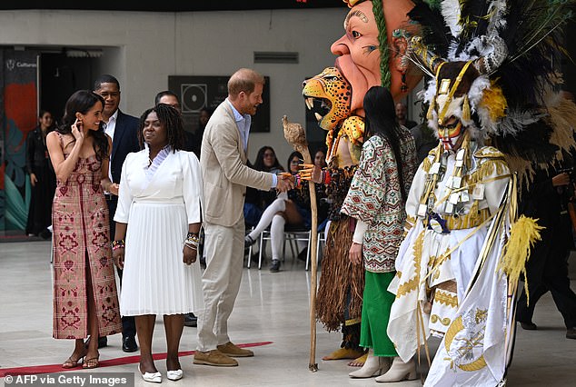 Harry meets a dancer at Centro Nacional de las Artes Delia Zapata in Bogota yesterday