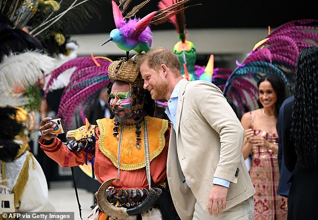 Harry meets a dancer at Centro Nacional de las Artes Delia Zapata in Bogota yesterday