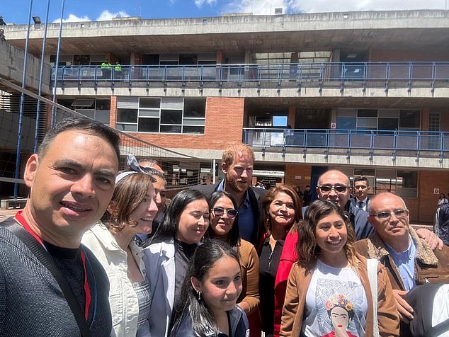 The Duke of Sussex meets people at the Colegio Cultura Popular school in Bogota yesterday