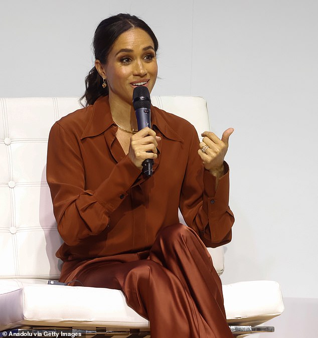 Pictured: Meghan Markle stunned in a silky brown ensemble as attended the 'Responsible Digital Future' forum at EAN University in Bogota on her first day of her and Prince Harry's Colombia tour