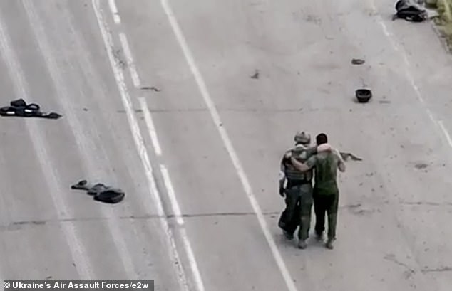 Wounded Russian troops are seen surrendering after their positions were overwhelmed