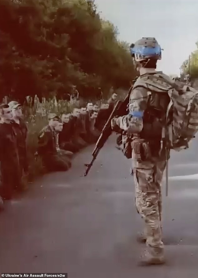 Dozens of Russian troops are seen having surrendered to Ukraine's forces in Kursk