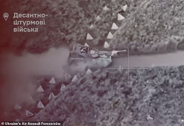 Ukrainian tanks are seen smashing through 'dragon's teeth' barriers in Kursk