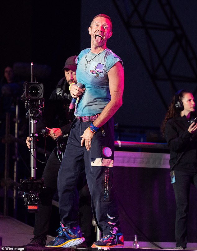 She has been repeatedly photographed dancing at Coldplay concerts over the years, but she is currently around 6,000 miles away from Martin, 47, who is in Munich on tour (pictured at Glastonbury in June)