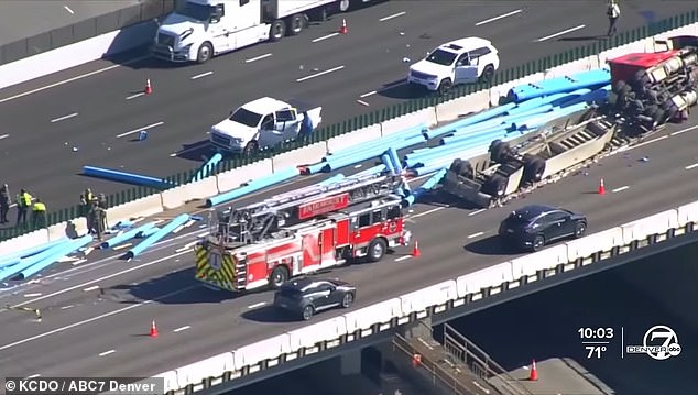 The truck's load spilled across both sides of the highway, causing at least three vehicles to crash