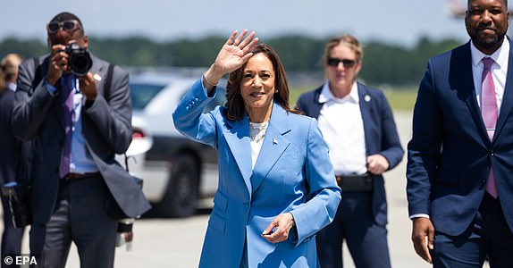 epa11551678 US Vice President Kamala Harris arrives at the Raleigh airport ahead of her economic policy speech at the Hendrick Center for Automotive Excellence in Raleigh, North Carolina, USA, 16 August 2024. Harris is expected to propose a federal ban on â¿¿corporate price gouging,' as well as new tax breaks for families. It will be the first major policy speech of Harris's presidential campaign.  EPA/JIM LO SCALZO