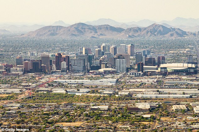 Pictured: An aerial view of the skyline in downtown Phoenix, Arizona, where the cost of a one-bedroom rental unit has jumped 84 percent over the last five years