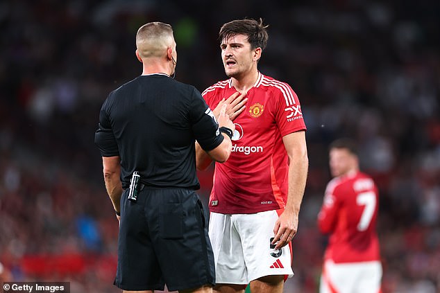 Harry Maguire (right) dominated Muniz and limited the Fulham striker during the game