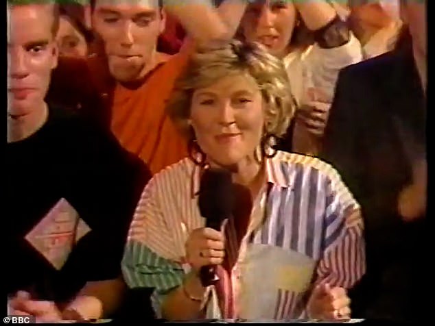 In the throwback clip, the TV star, who is now 64, presented from the BBC studio floor, in a vibrant, multi-coloured striped shirt