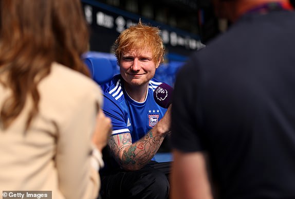 IPSWICH, ENGLAND - AUGUST 17: Ed Sheeran, English singer-songwriter and minority shareholder of Ipswich Town FC speaks to the media prior to the Premier League match between Ipswich Town FC and Liverpool FC at Portman Road on August 17, 2024 in Ipswich, England. (Photo by Julian Finney/Getty Images)