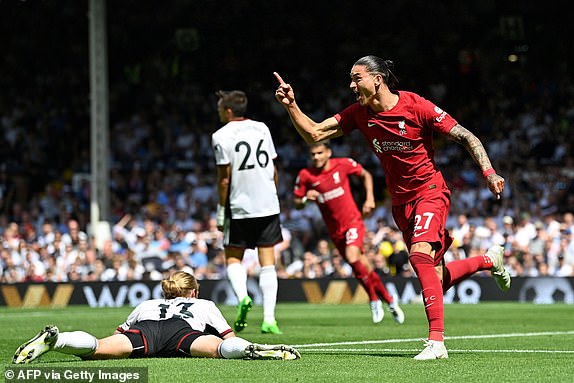 Liverpool's Uruguayan striker Darwin Nunez (R) celebrates after scoring their first goal during the English Premier League football match between Fulham and Liverpool at Craven Cottage in London on August 6, 2022. (Photo by JUSTIN TALLIS / AFP) / RESTRICTED TO EDITORIAL USE. No use with unauthorized audio, video, data, fixture lists, club/league logos or 'live' services. Online in-match use limited to 120 images. An additional 40 images may be used in extra time. No video emulation. Social media in-match use limited to 120 images. An additional 40 images may be used in extra time. No use in betting publications, games or single club/league/player publications. /  (Photo by JUSTIN TALLIS/AFP via Getty Images)