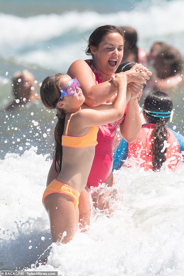 Jacqueline and Mia had fun while larking around in the sea