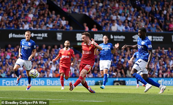 Liverpool's Diogo Jota scores their side's first goal of the game during the Premier League match at Portman Road, Ipswich. Picture date: Saturday August 17, 2024. PA Photo. See PA story SOCCER Ipswich. Photo credit should read: Bradley Collyer/PA Wire.RESTRICTIONS: EDITORIAL USE ONLY No use with unauthorised audio, video, data, fixture lists, club/league logos or "live" services. Online in-match use limited to 120 images, no video emulation. No use in betting, games or single club/league/player publications.