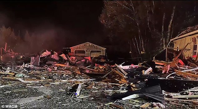 'I heard a boom and I felt like the floor was going to cave into the cellar and the roof was going to fall in on top of me,' she said (pictured: debris from the explosion)