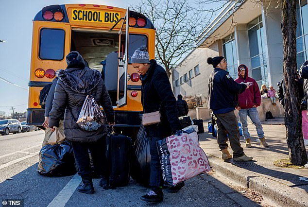 Venezuelan migrants load onto a bus in Chicago after recently arriving to the city