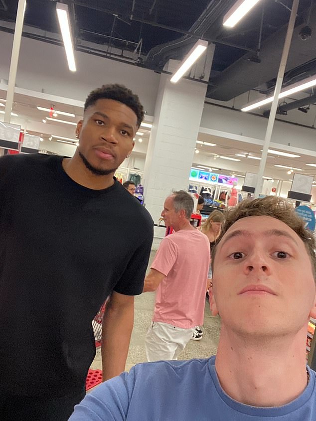 Antetokounmpo posed for a picture with a fan while he was shopping at a FiDi Target