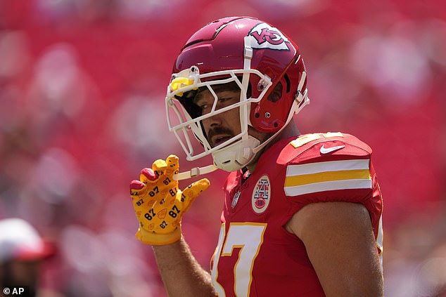 TIME FOR BUSINESS: Kelce then flocked on his trademark No. 87 red Chiefs jersey and gloves