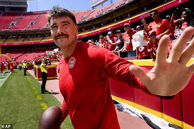 Kelce waves to Chiefs fans as he runs out onto the field for the preseason game in Kansas City