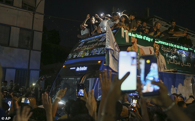 It was hard for the bus to move as people raised their hands and tried to take a picture of her